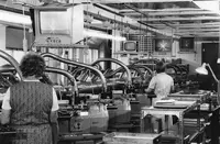 Centering of lenses (alignment of optical and mechanical centres) on Leitz designed machines with autocollimation telescopes and TV monitors.